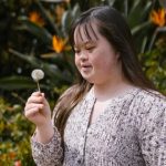 Child with a dandelion 'clock'